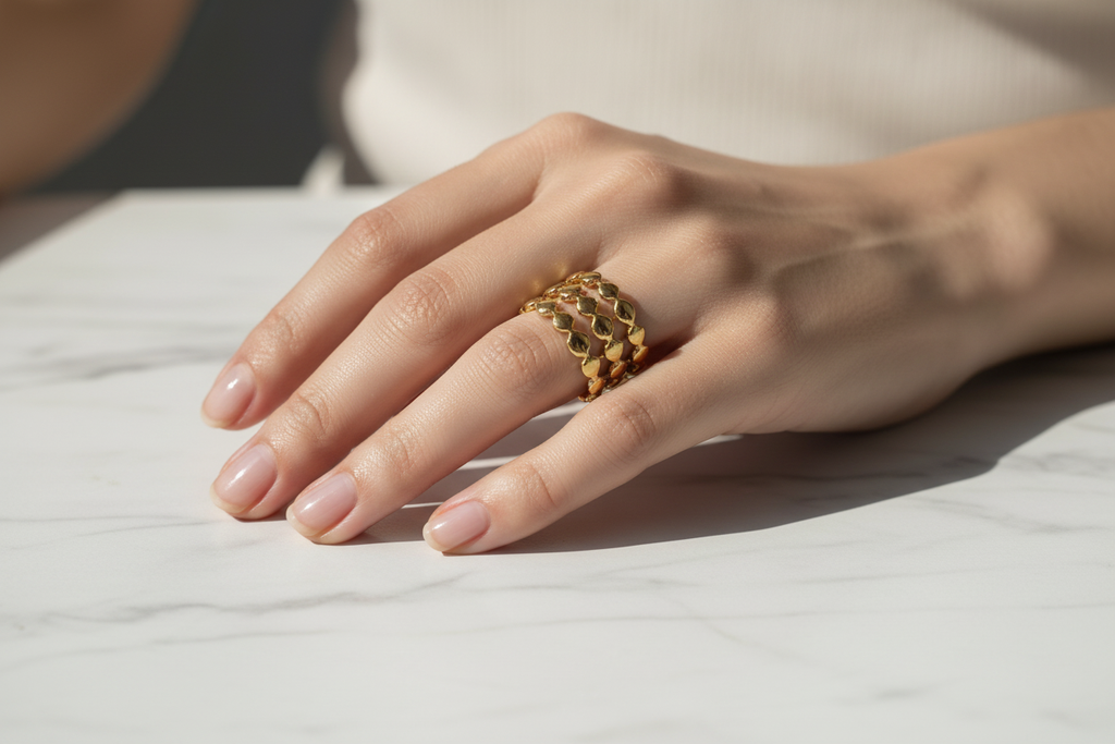 Gold chain ring on marble